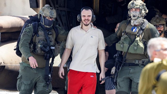 Andrey Kozlov, a released hostage is escorted, after the military said that Israeli forces have rescued four hostages alive from the central Gaza Strip on Saturday, in Ramat Gan, Israel June 8, 2024. REUTERS/Marko Djurica