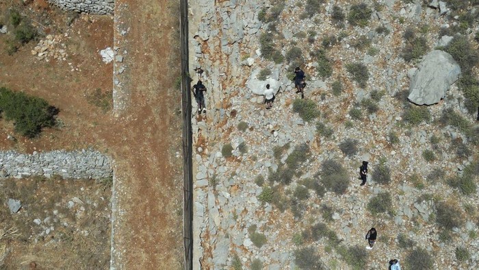 The body of missing British TV presenter Michael Mosley lies on a rocky area on the island of Symi, Sunday, June 9, 2024. The family of missing British TV presenter Dr. Michael Mosley have confirmed his body has been found on a Greek island. Mosley’s wife said Sunday in a statement that her husband had gone for a hike and took the wrong route and collapsed in a place where his body couldn’t easily be seen. (AP Photo/Panormitis Chatzigiannakis)