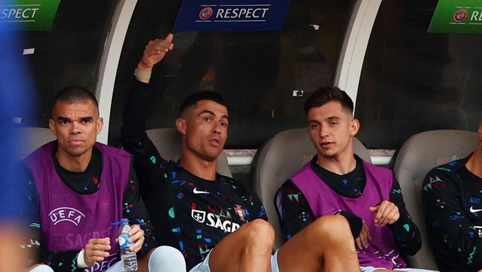 Soccer Football - International Friendly - Portugal v Croatia - Centro Desportivo Nacional do Jamor, Oeiras, Portugal - June 8, 2024 Portugals Pepe and Portugals Cristiano Ronaldo are seen on the bench REUTERS/Pedro Nunes