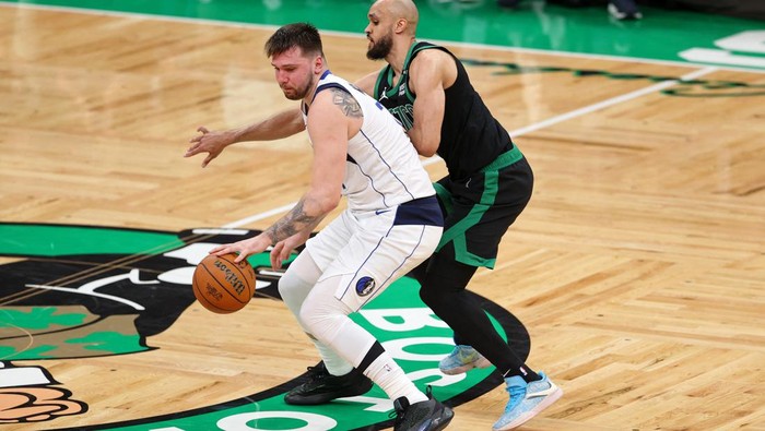 Jun 9, 2024; Boston, Massachusetts, USA; Dallas Mavericks guard Luka Doncic (77) controls the ball against Boston Celtics center Al Horford (42) during the fourth quarter in game two of the 2024 NBA Finals at TD Garden. Mandatory Credit: Peter Casey-USA TODAY Sports