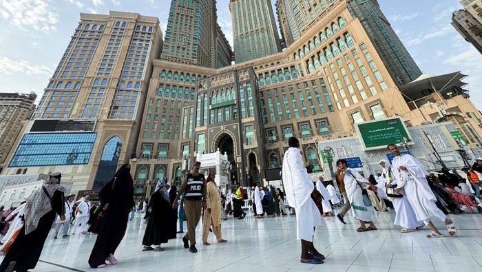 Muslims walk at the Grand Mosque, ahead of the annual haj pilgrimage, in Mecca, Saudi Arabia, June 9, 2024. REUTERS/Saleh Salem