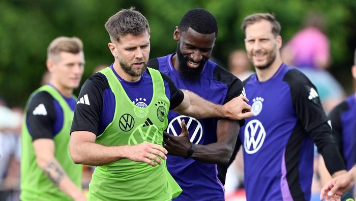 10 June 2024, Bavaria, Herzogenaurach: Soccer: European Championship, national team, training, Germanys Niclas Füllkrug (l) and Antonio Rüdiger during public training in the Adi Dassler Stadium. Photo: Federico Gambarini/dpa (Photo by Federico Gambarini/picture alliance via Getty Images)