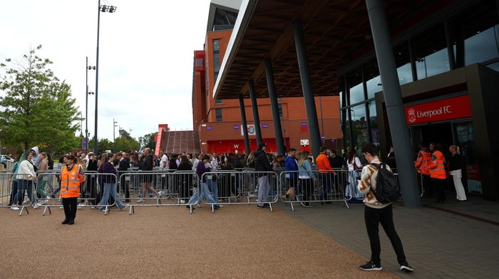 People leave the club shop at Anfield Stadium after an early merchandise release for Taylor Swift fans, in Liverpool, Britain June 12, 2024. REUTERS/Molly Darlington