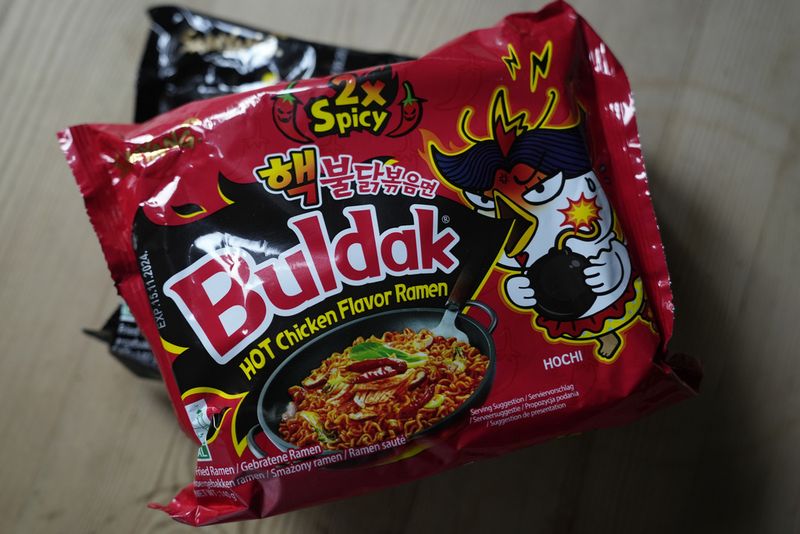 In this photo illustration two packets of Samyang noodles are pictured in London, Wednesday, June 12, 2024. Food authorities in Denmark have recalled three types of spicy instant noodle products imported from South Korea over possible risks for 