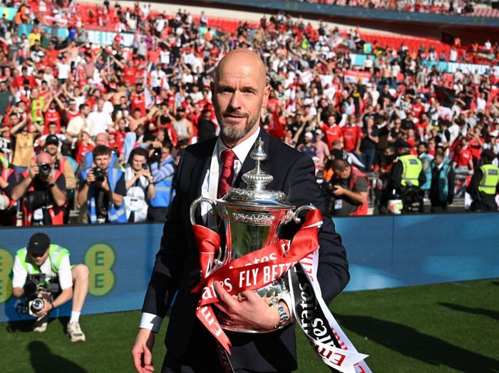 LONDON, ENGLAND - MAY 25: Erik ten Hag, manager of Manchester United looks on with the FA Cup trophy after the Emirates FA Cup Final match between Manchester City and Manchester United at Wembley Stadium on May 25, 2024 in London, England. (Photo by Michael Regan - The FA/The FA via Getty Images)