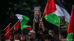 Potret Warga Gelar Aksi Bela Palestina di Tugu Proklamasi