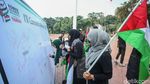 Potret Warga Gelar Aksi Bela Palestina di Tugu Proklamasi