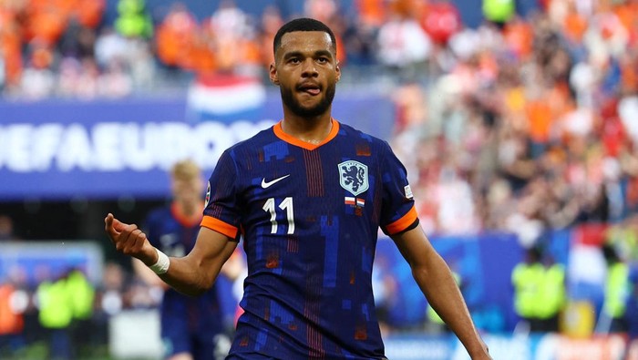 Soccer Football - Euro 2024 - Group D - Poland v Netherlands - Hamburg Volksparkstadion, Hamburg, Germany - June 16, 2024 Netherlands Cody Gakpo celebrates scoring their first goal REUTERS/Kacper Pempel