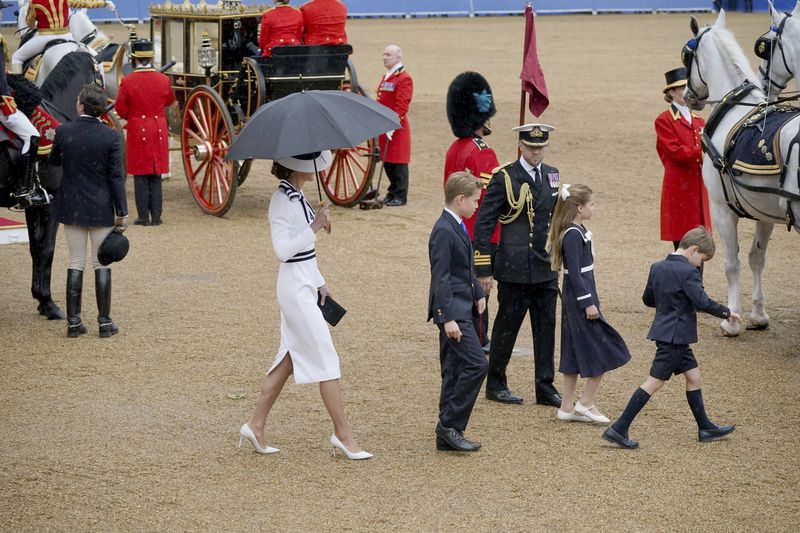 Britain's Kate, Princess of Wales, Prince Louis, right, Princess Charlotte and Prince George leave Horse Guards Parade after the Trooping the Color ceremony at Horse Guards Parade, London, Saturday, June 15, 2024. Britain is putting on a display of birthday pageantry for King Charles III, a military parade that is the Princess of Wales' first public appearance since her cancer diagnosis early this year. (Yui Mok/PA via AP)