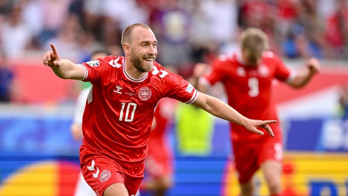 STUTTGART, GERMANY - JUNE 16: Christian Eriksen of Denmark celebrates after scoring his teams first goal with teammates during the UEFA EURO 2024 group stage match between Slovenia and Denmark at Stuttgart Arena on June 16, 2024 in Stuttgart, Germany. (Photo by Harry Langer/DeFodi Images via Getty Images)