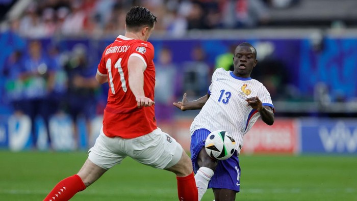 DUSSELDORF, GERMANY - JUNE 17: (L-R) Michael Gregoritsch of Austria , NGolo Kante of France  during the  EURO match between Austria  v France at the Merkur Spiel Arena on June 17, 2024 in Dusseldorf Germany (Photo by Rico Brouwer/Soccrates/Getty Images)