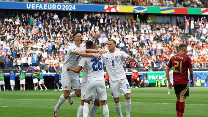 Soccer Football - Euro 2024 - Group E - Belgium v Slovakia - Frankfurt Arena, Frankfurt, Germany - June 17, 2024 Slovakias Ivan Schranz celebrates scoring their first goal with teammates REUTERS/Lee Smith