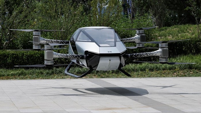 An engineer inspects the propellers of the electric flying car XPeng Voyager X2 by XPeng AeroHT, before a demonstration flight in Beijing, China June 18, 2024. REUTERS/Tingshu Wang