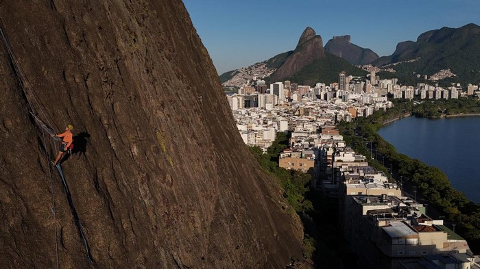 A drone view shows people climbing the Morro do Cantagalo stone in Rio de Janeiro, Brazil June 18, 2024. REUTERS/Pilar Olivares