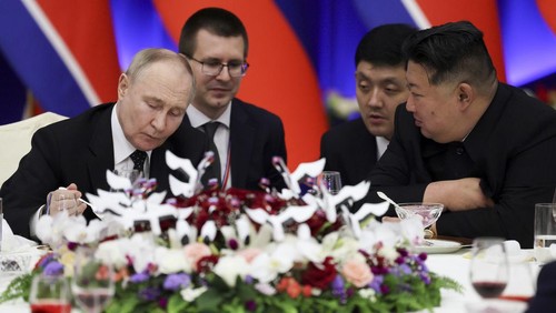 Russian President Vladimir Putin, left, and North Koreas leader Kim Jong Un attend a State Reception after their talks in Pyongyang, North Korea, on Wednesday, June 19, 2024. (Gavriil Grigorov, Sputnik, Kremlin Pool Photo via AP)