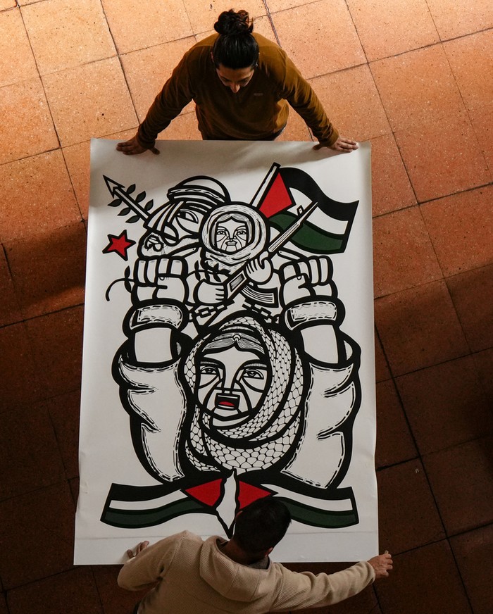Workers prepare art from around the world for an exhibition called, 