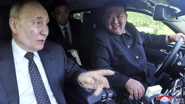 The two autocrats appeared to enjoy each other's company as they took a jaunt in the Aurus luxury car. KCNA/AP