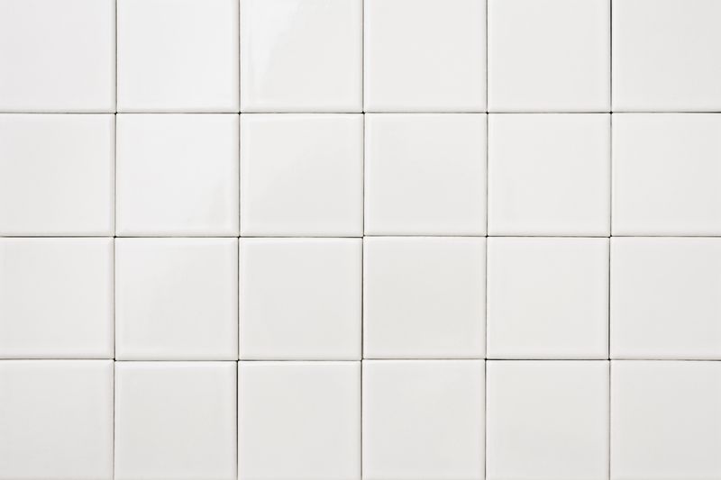 Close-up of white tile background.