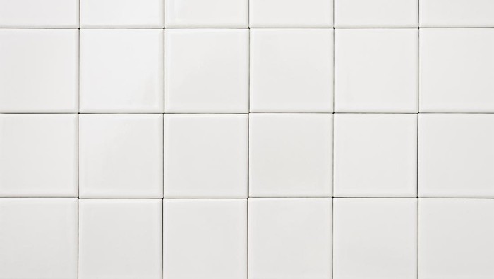 Close-up of white tile background.
