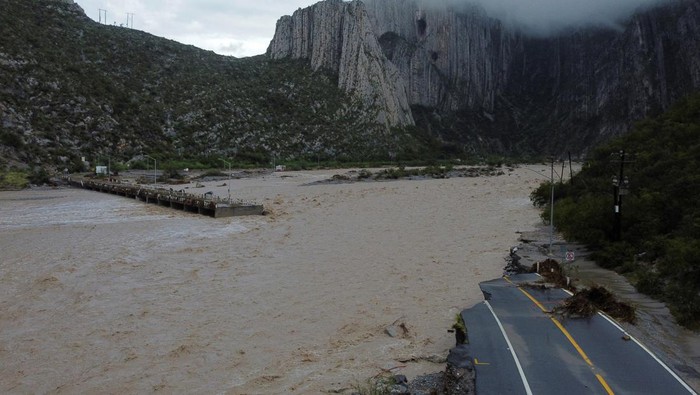 A drone view shows a destroyed vehicular bridge in the aftermath of tropical storm Alberto at La Huasteca Park, in Santiago, Mexico June 21, 2024. REUTERS/Daniel Becerril  REFILE - QUALITY REPEAT DUE TO TRANSMISSION ERROR