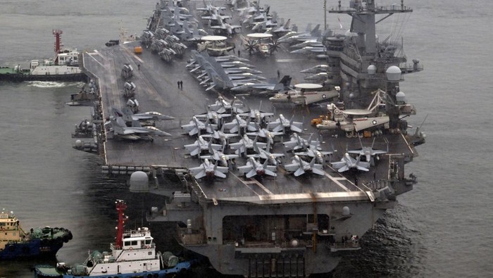 The Theodore Roosevelt (CVN 71), a nuclear-powered aircraft carrier is anchored in Busan, South Korea, June 22, 2024. Song Kyung-Seok/Pool via REUTERS