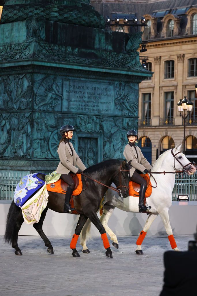 PARIS, FRANCE - JUNE 23: Kendall Jenner and Gigi Hadid ride horses on the runway during Vogue World: Paris at Place Vendome on June 23, 2024 in Paris, France. (Photo by Kristy Sparow/Getty Images for Vogue)