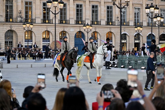 PARIS, FRANCE - JUNE 23: Kendall Jenner and Gigi Hadid ride horses on the runway during Vogue World: Paris at Place Vendome on June 23, 2024 in Paris, France. (Photo by Kristy Sparow/Getty Images for Vogue)