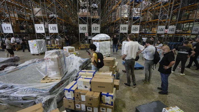 Lebanon Israel Palestinians Journalists are given a tour inside a cargo center at the Rafik Hariri International Airport in Beirut, Lebanon, Monday, June 24, 2024. The tour comes a day after a British newspaper published a story, citing anonymous airport workers, claiming that Hezbollah is storing weapons at the airport, as monthslong clashes with the Israeli military on the Lebanon-Israel border have significantly escalated in recent weeks. (AP Photo/Bilal Hussein)