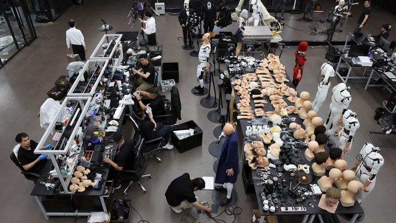 Employees work at the office of humanoid robots developer Ex-Robots in Dalian, Liaoning province, China June 6, 2024. REUTERS/Florence Lo