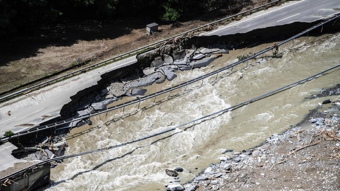Aerial view of the area affected by the landslide with the houses in the hamlet of Sorte engulfed by stones in Lostallo, Southern Switzerland, after a landslide, caused by the bad weather and heavy rain in the Misox valley, Saturday, June 22 2024. Massive thunderstorms and rainfall led to a flooding situation on Friday evening after a landslide in the Misox valley. Four people went missing on Saturday morning. Several dozen people had to be evacuated from their homes in the Misox and Calanca regions. (Samuel Golay/Keystone via AP)