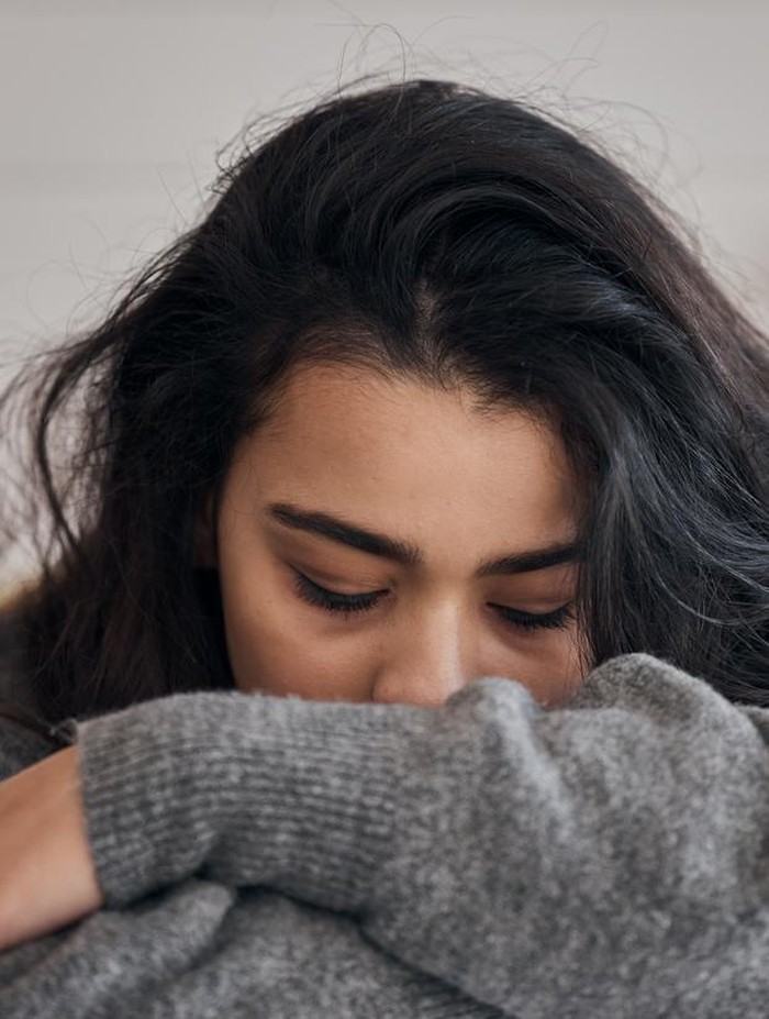 1465662173 Woman, stress and depression in lonely mental health problems, issues or anxiety at home. Sad female face suffering from loneliness, withdrawal or abuse with depressed emotion alone in the bedroom