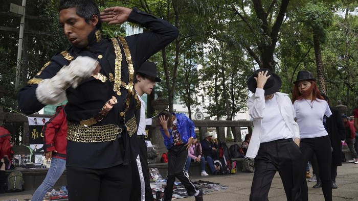 Michael Jackson fans perform to his number one hit 