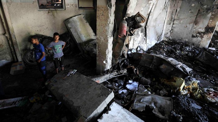 Palestinians inspect the damages at Abdulfattah Hamoud school where displaced people were taking refuge, following an Israeli strike, amid Israel-Hamas conflict, in Gaza City, June 25, 2024. REUTERS/Dawoud Abu Alkas