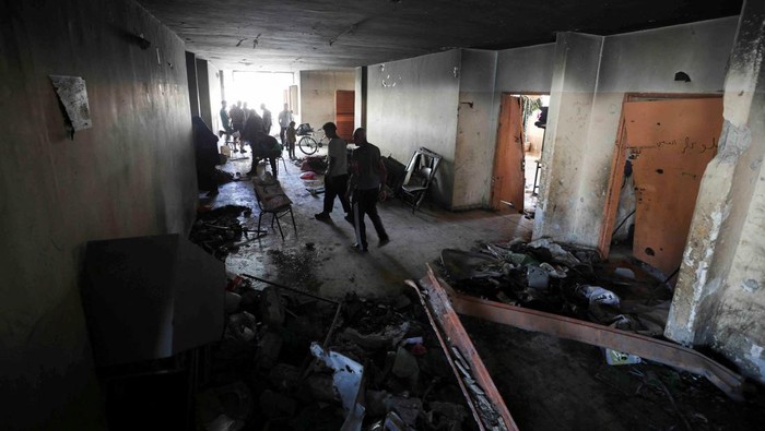Palestinians inspect the damages at Abdulfattah Hamoud school where displaced people were taking refuge, following an Israeli strike, amid Israel-Hamas conflict, in Gaza City, June 25, 2024. REUTERS/Dawoud Abu Alkas
