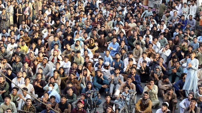 Afghan cricket fans watch the men's T20 World Cup semifinal cricket match between Afghanistan and South Africa, on a big screen in the city of Jalalabad, east of Afghanistan, Thursday, June 27, 2024. (AP Photo/Shafiullah Kakar)