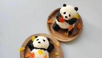 Dua ekor Panda ini terbuat dari kepalan nasi dan nori. Lalu ada hiasan daun maple yang dibuat dari sayuran. Duh lucunya! Foto: Min Kyungjin via Bored Panda