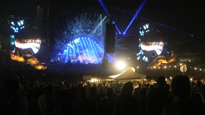 Music fans enjoy the Nova Healing Concert in Tel Aviv, Israel, on Thursday, June 27, 2024. This was the first Tribe of Nova mass gathering since the Oct. 7, 2023 cross-border attack by Hamas that left hundreds at the Nova music festival dead or kidnapped to Gaza. (AP Photo/Ohad Zwigenberg)