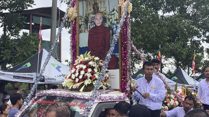 A crowd of Buddhist clergy and devotees attend the cremation of the late monk Bhaddanta Munindarbhivamsa in Bago, Myanmar, Thursday, June 27, 2024. The senior monk was shot dead last week by soldiers who the military government said mistaked the vehicle in which he was traveling for a security threat. (AP Photo)