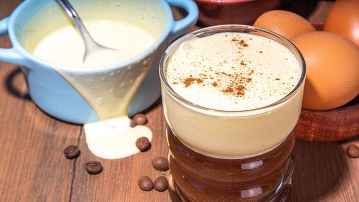 Vietnamese Egg Coffee. Paleo, Dairy-free keto coffee latte drink with sweet sugared Whipped yolks