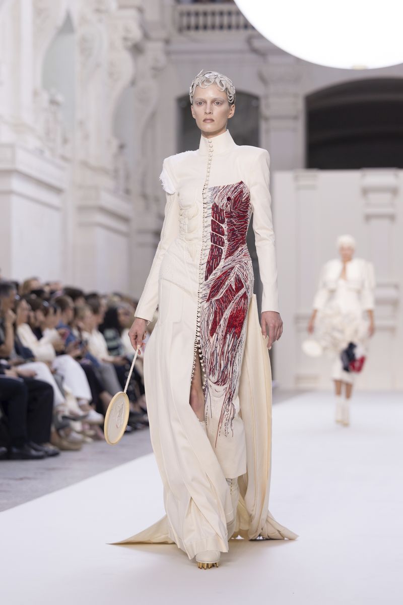 A model wears a creation for the Thom Browne Haute Couture Fall-Winter 2024-2025 collection presented Monday, June 24, 2024 in Paris. (Photo by Vianney Le Caer/Invision/AP)