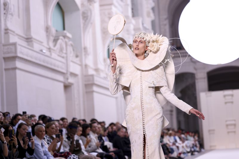 A model wears a creation for the Thom Browne Haute Couture Fall-Winter 2024-2025 collection presented Monday, June 24, 2024 in Paris. (Photo by Vianney Le Caer/Invision/AP)