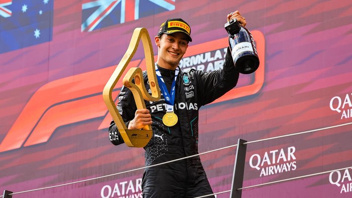 SPIELBERG, AUSTRIA - JUNE 30: Race winner George Russell of Great Britain and Mercedes celebrates on the podium after the F1 Grand Prix of Austria at Red Bull Ring on June 30, 2024 in Spielberg, Austria. (Photo by Kym Illman/Getty Images)