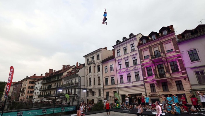 A man attempts to break the world record of the highest trampoline jump in Ljubljana, Slovenia June 29, 2024. REUTERS/Borut Zivulovic