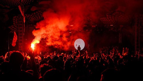 GLASTONBURY, ENGLAND - JUNE 30: Fatboy Slim is silhouetted against graphics as he performs on the Glade State in the early hours of day five of Glastonbury Festival 2024 at Worthy Farm, Pilton on June 30, 2024 in Glastonbury, England. Founded by Michael Eavis in 1970, Glastonbury Festival features around 3,000 performances across over 80 stages. Renowned for its vibrant atmosphere and iconic Pyramid Stage, the festival offers a diverse lineup of music and arts, embodying a spirit of community, creativity, and environmental consciousness. (Photo by Leon Neal/Getty Images)