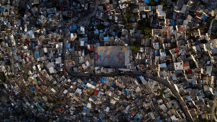A drone view shows the sun setting over the Jalousie neighborhood, following the arrival of the first contingent of Kenyan police as part of a peacekeeping mission in the Caribbean country, in Port-au-Prince, Haiti June 30, 2024. REUTERS/Ricardo Arduengo