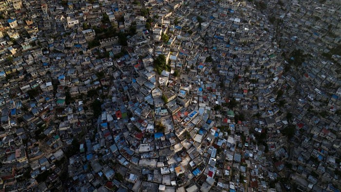 A drone view shows the sun setting over the Jalousie neighborhood, following the arrival of the first contingent of Kenyan police as part of a peacekeeping mission in the Caribbean country, in Port-au-Prince, Haiti June 30, 2024. REUTERS/Ricardo Arduengo