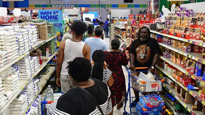 People shop in a supermarket ahead of the arrival of Hurricane Beryl in Bridgetown, Barbados June 30, 2024.  REUTERS/Nigel R Browne