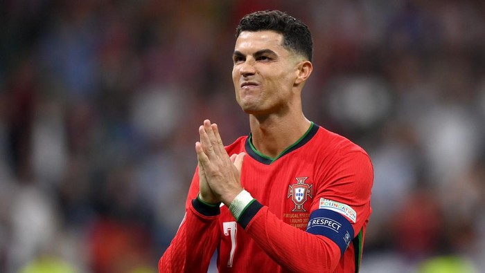 FRANKFURT AM MAIN, GERMANY - JULY 01: Cristiano Ronaldo of Portugal celebrates scoring the teams first penalty in the penalty shoot out during the UEFA EURO 2024 round of 16 match between Portugal and Slovenia at Frankfurt Arena on July 01, 2024 in Frankfurt am Main, Germany. (Photo by Justin Setterfield/Getty Images)