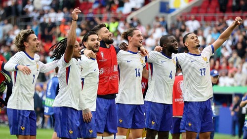 DUSSELDORF, GERMANY - JULY 01: France players Antoine Griezmann of France , Jules Kounde of France , Olivier Giroud of France , Adrien Rabiot of France , Dayot Upamecano of France , William Saliba of France celebrate with the fans after their sides victory the UEFA EURO 2024 round of 16 match between France and Belgium at Düsseldorf Arena on July 01, 2024 in Dusseldorf, Germany. (Photo by Stefan Matzke - sampics/Getty Images)