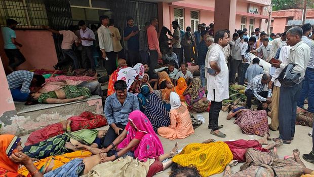 SENSITIVE MATERIAL. THIS IMAGE MAY OFFEND OR DISTURB A woman is consoled as she mourns after her son died in a stampede outside a hospital in Hathras district in the northern state of Uttar Pradesh, India, July 2, 2024. REUTERS/Stringer  BEST QUALITY AVAILABLE     TPX IMAGES OF THE DAY